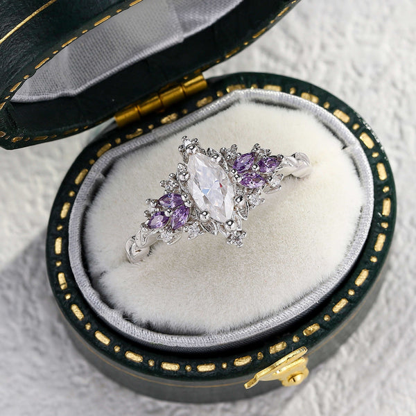 Zeloriel ring with 0.7 ct marquise moissanite and purple gemstone accents in a velvet box