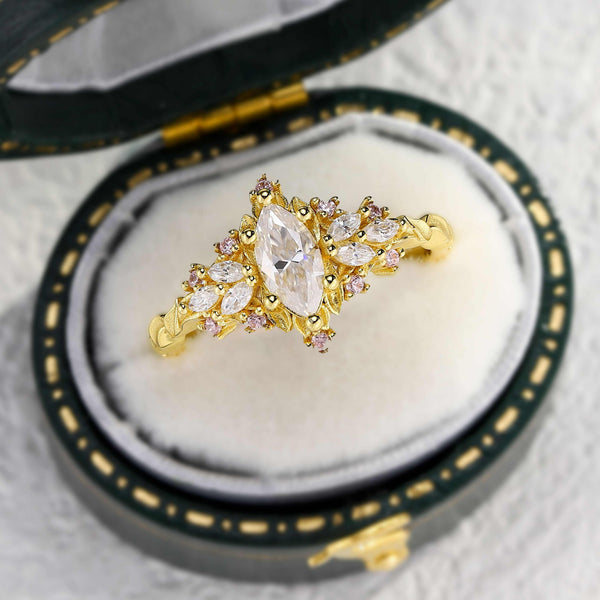 Xinalwen solitaire engagement ring with 0.7 carat marquise moissanite in gold setting