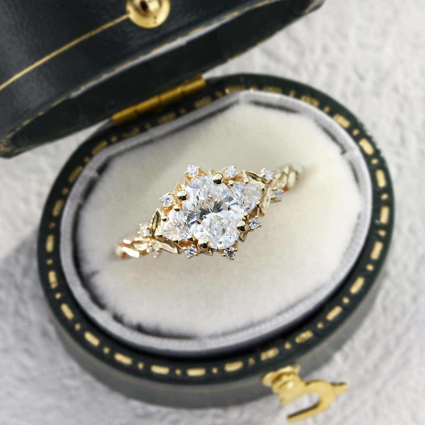 Mirithwen ring with 4ct oval moissanite center stone and side stones in elegant ring box