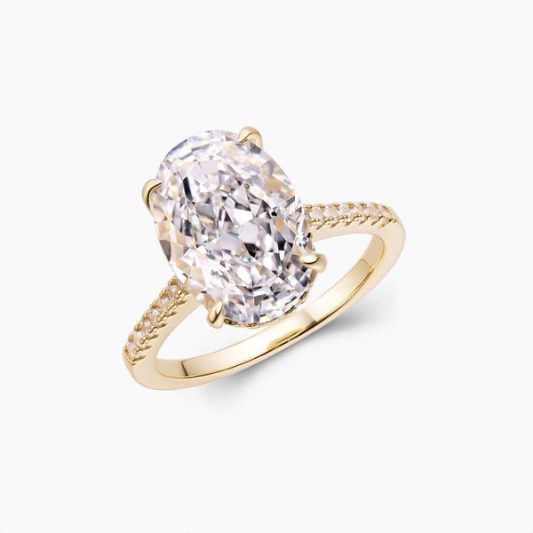 Reloriel engagement ring with large oval Moissanite stone and half pavé band in gold