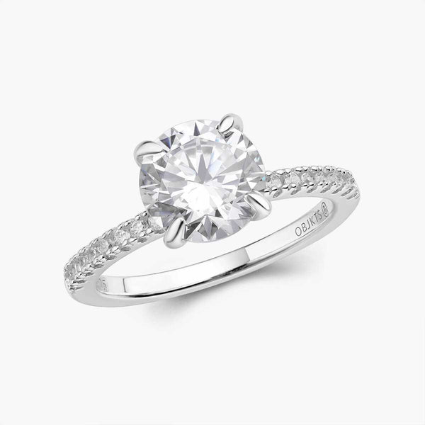 Ysinwen ring with a brilliant round moissanite stone and pave band solitaire design