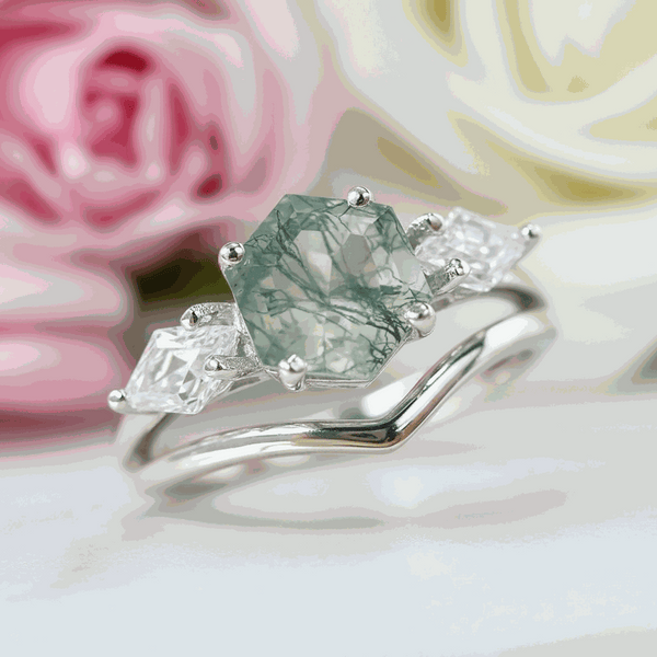 Hexagonal moss agate ring with kite-shaped side stones on silver band
