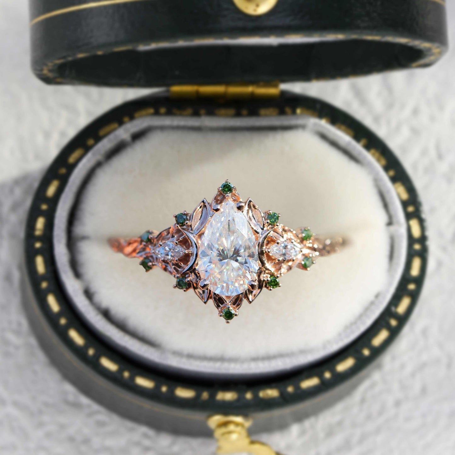 Belinor pear-shaped moissanite ring with side stones in vintage style box