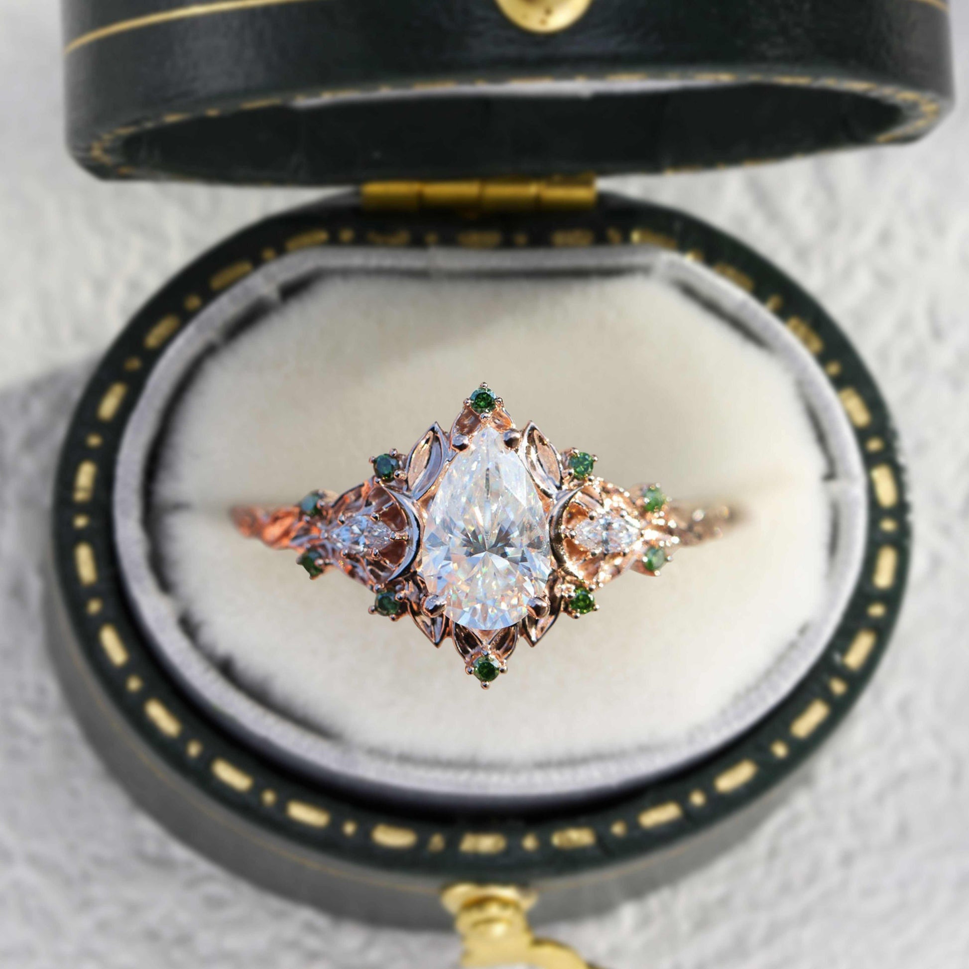 Belinor pear-shaped moissanite ring with side stones in vintage style box