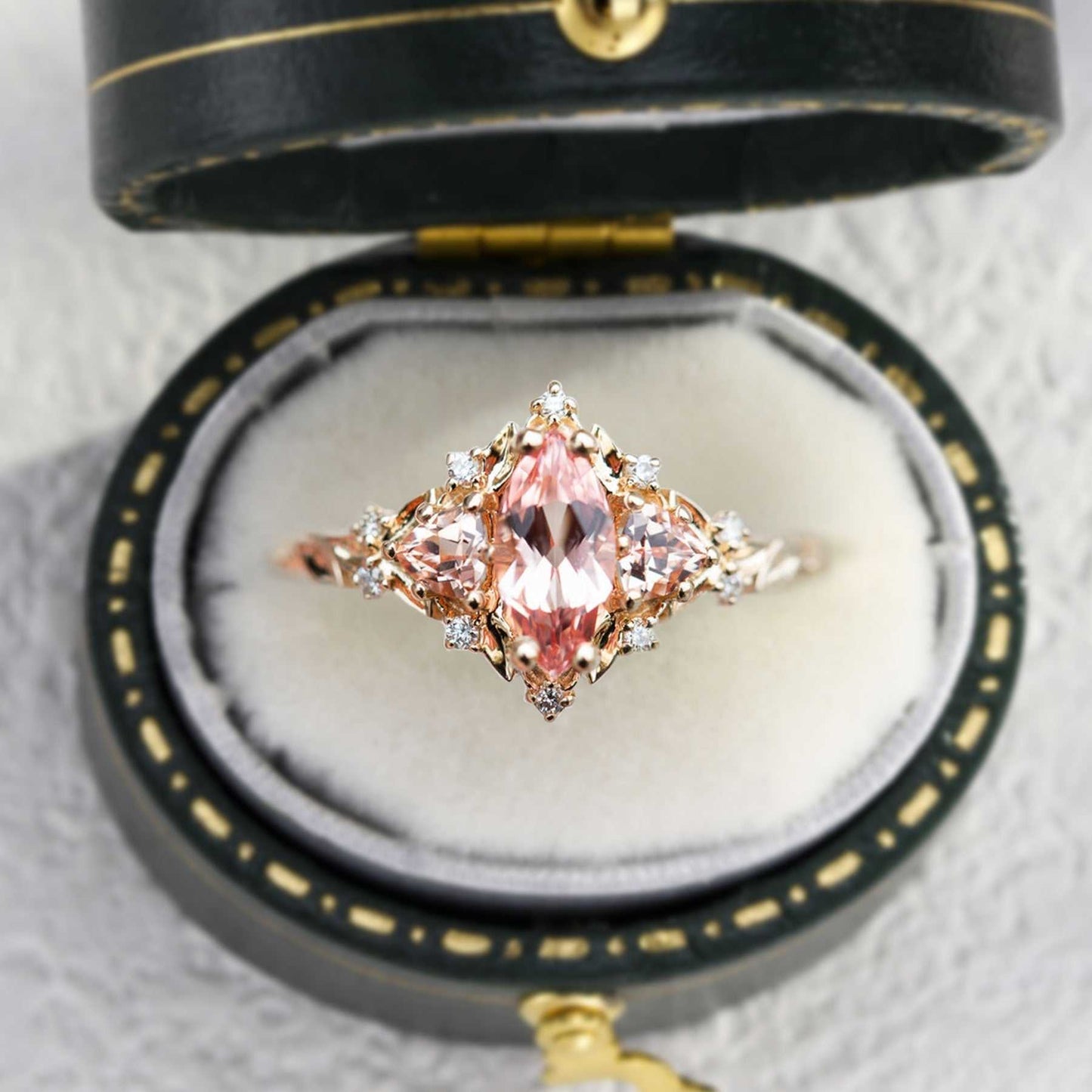 Nestariel solitaire engagement ring with marquise-shaped sapphire in vintage box