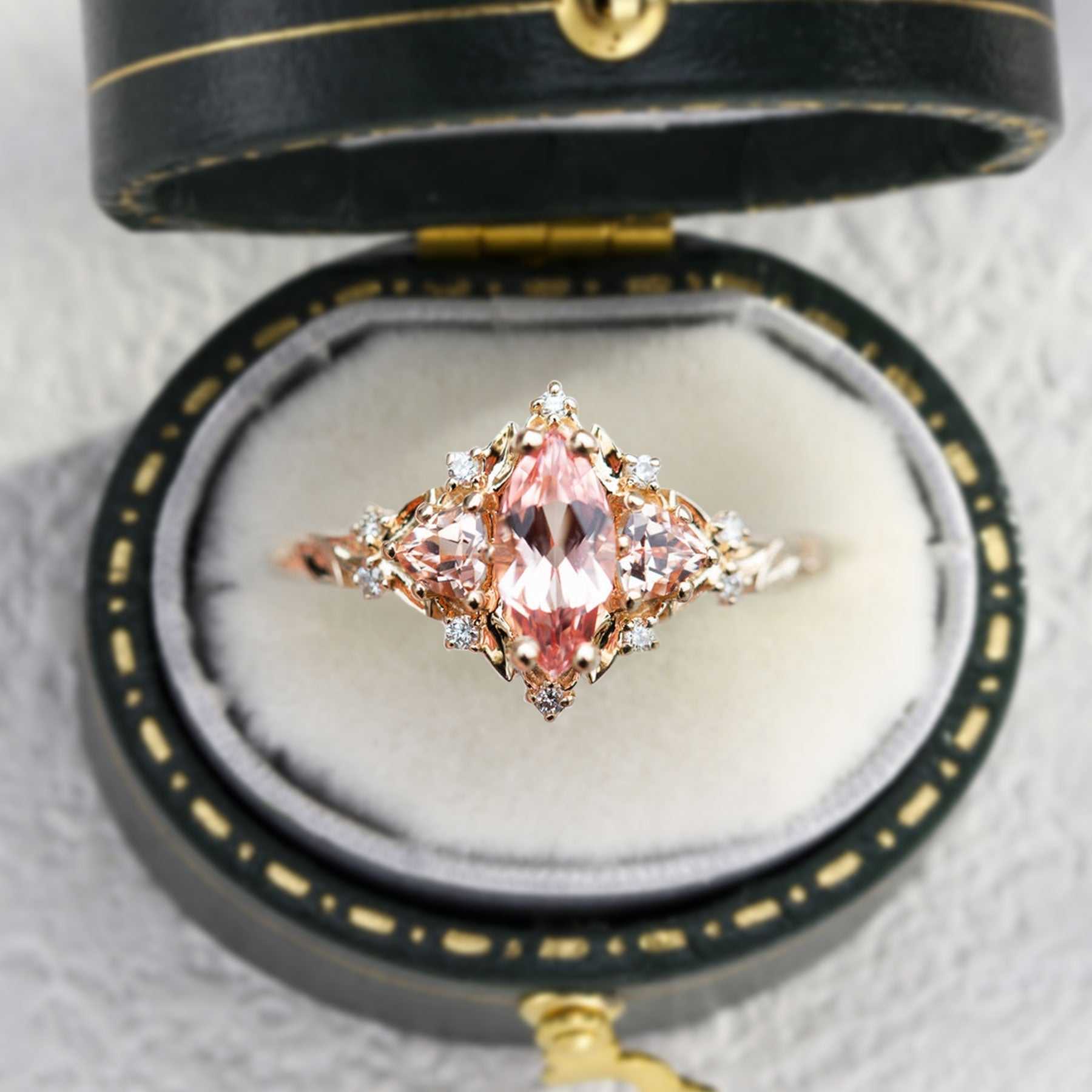 Nestariel solitaire engagement ring with marquise-shaped sapphire in vintage box