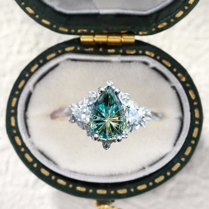 Garaniel engagement ring with pear-shaped sapphire and moissanite stones in vintage box