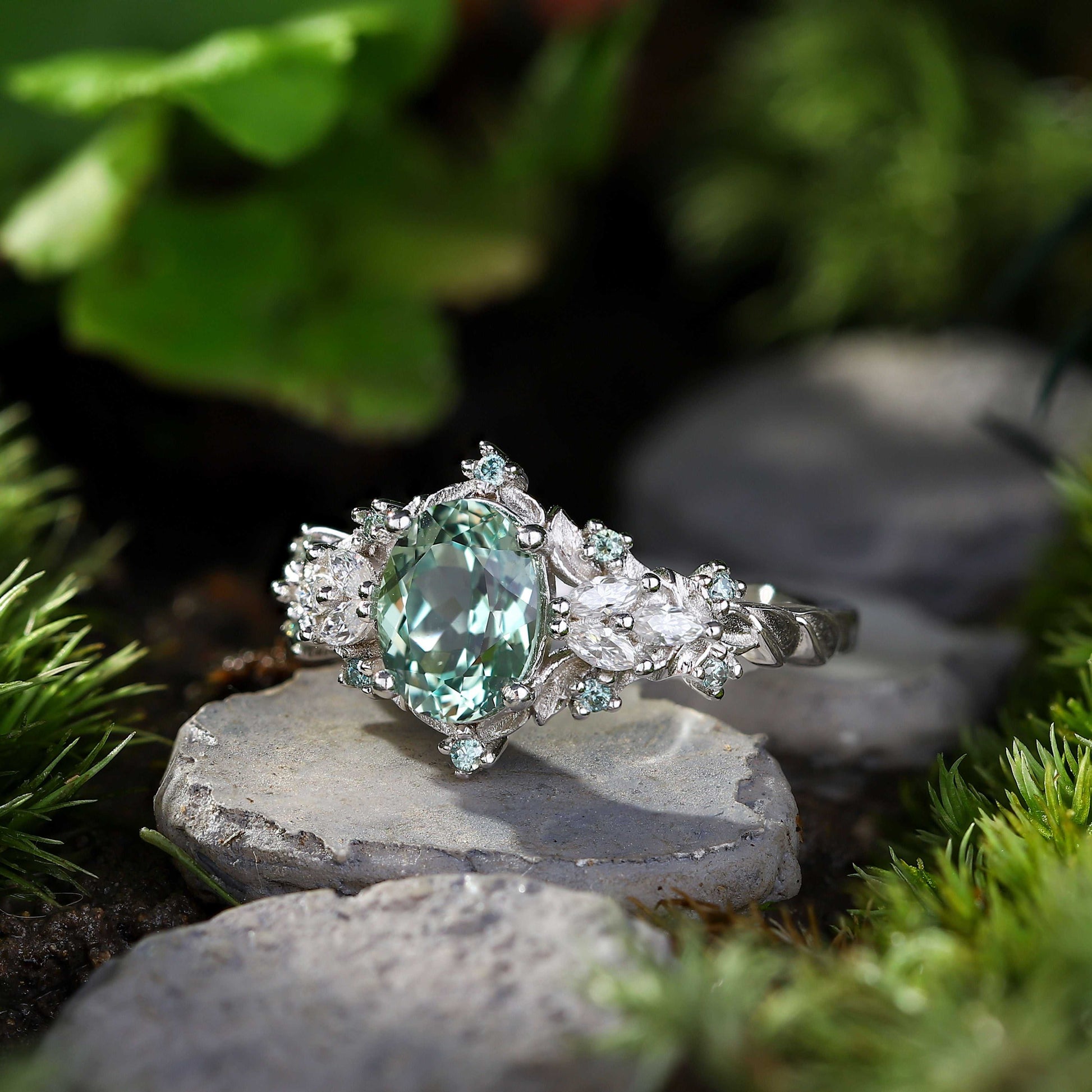 Tyranel engagement ring with oval sapphire and marquise moissanite halo on silver band