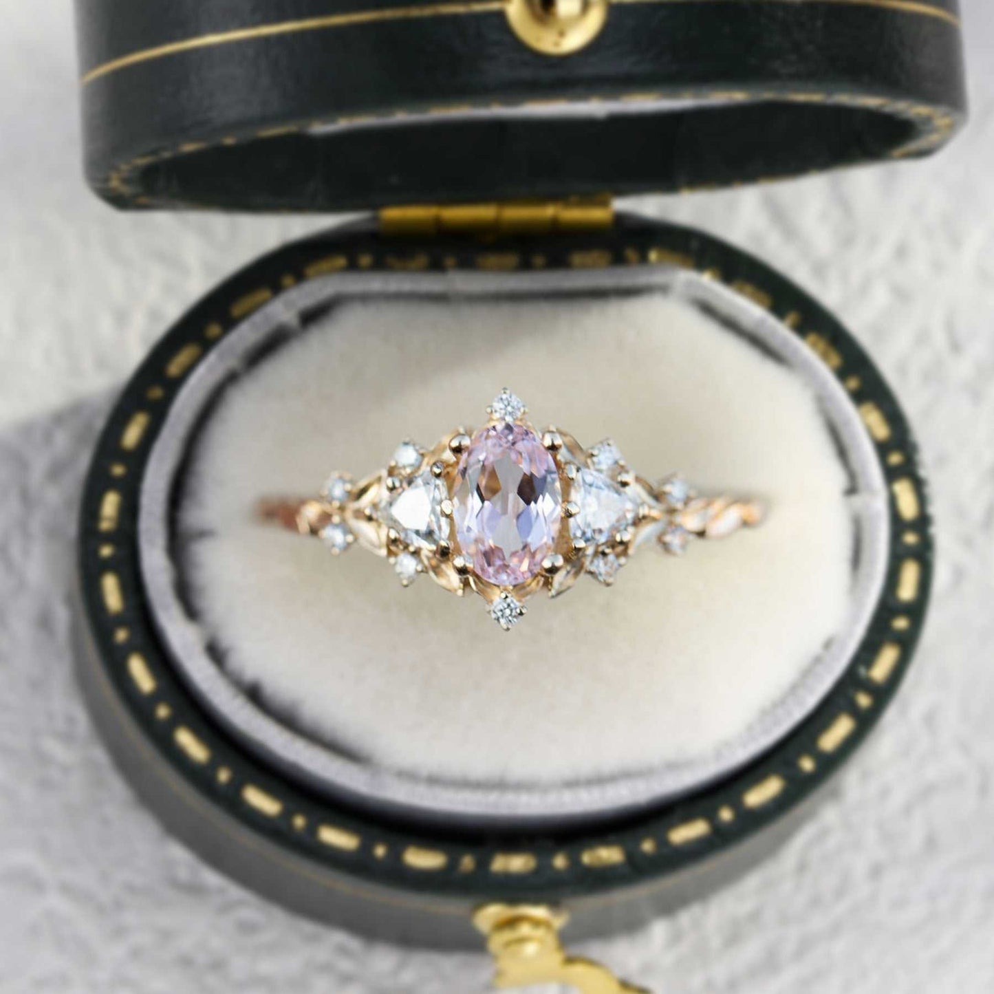 Uthriel three-stone engagement ring with oval sapphire center and moissanite side stones in vintage box