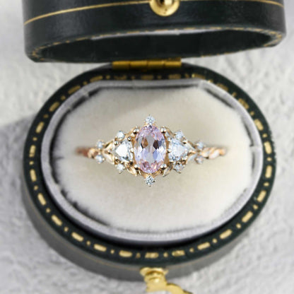 Uthriel three-stone engagement ring with oval sapphire center and moissanite side stones in vintage box