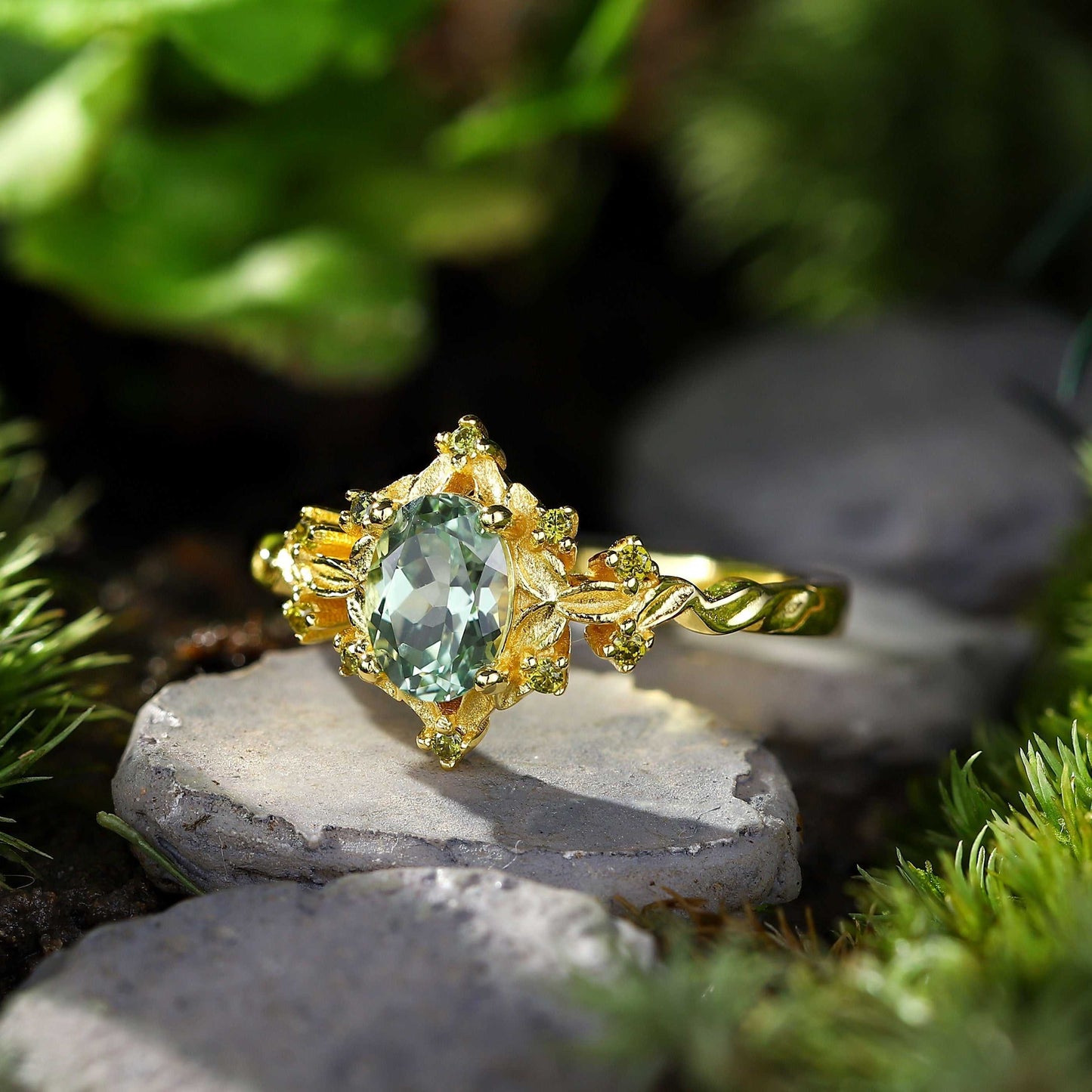 Xevoria solitaire engagement ring with oval sandstone center and delicate round sandstone accents in gold setting