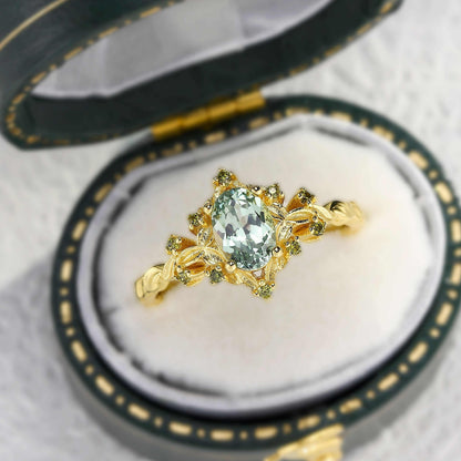 Xevoria solitaire engagement ring with oval sandstone center stone and gold twisted band in jewelry box