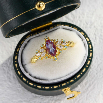 Lysaniel solitaire engagement ring with marquise lab Alexandrite and moissanite stones in gold setting