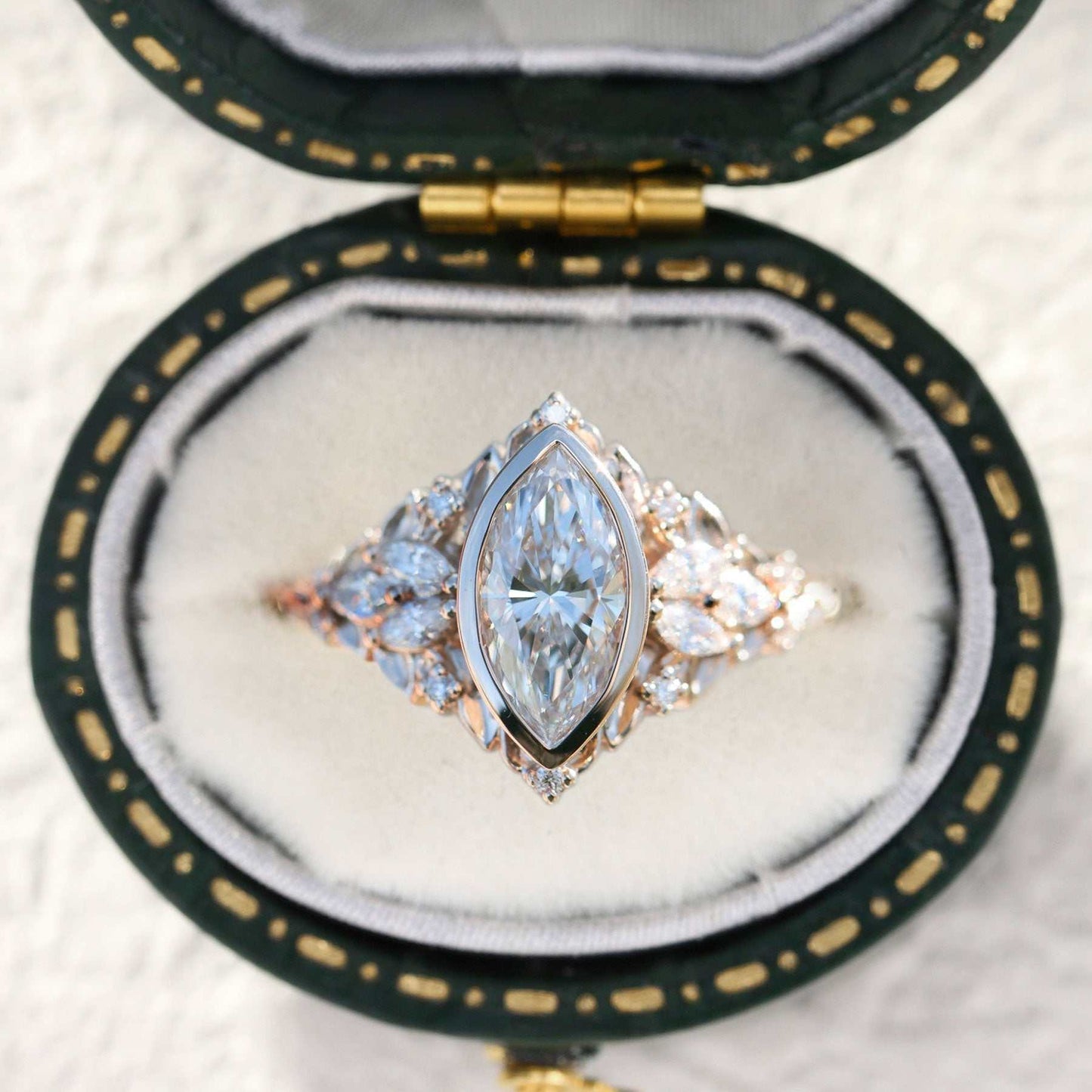 Uthawen solitaire engagement ring with marquise-shaped moissanite and delicate band in a velvet box