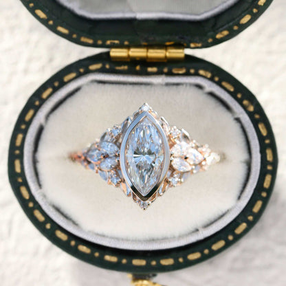 Uthawen solitaire engagement ring with marquise-shaped moissanite and delicate band in a velvet box