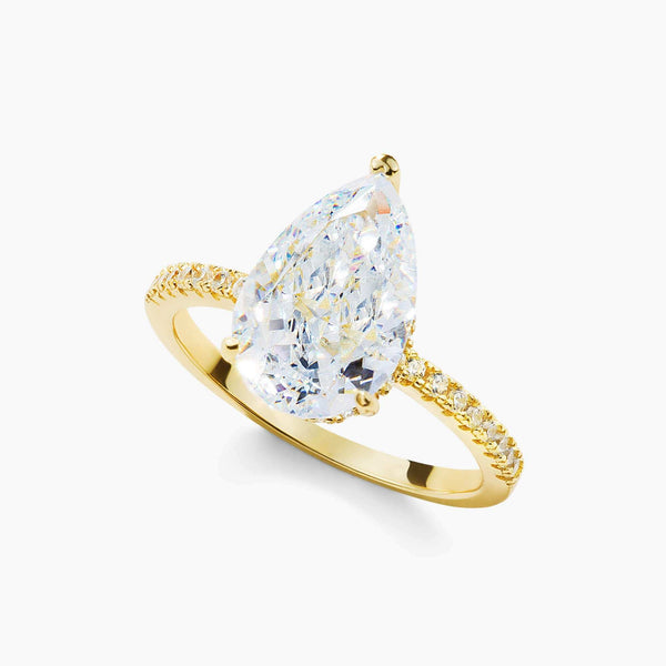 Kylariel pear-shaped moissanite solitaire engagement ring with half pavé band and hidden halo in gold