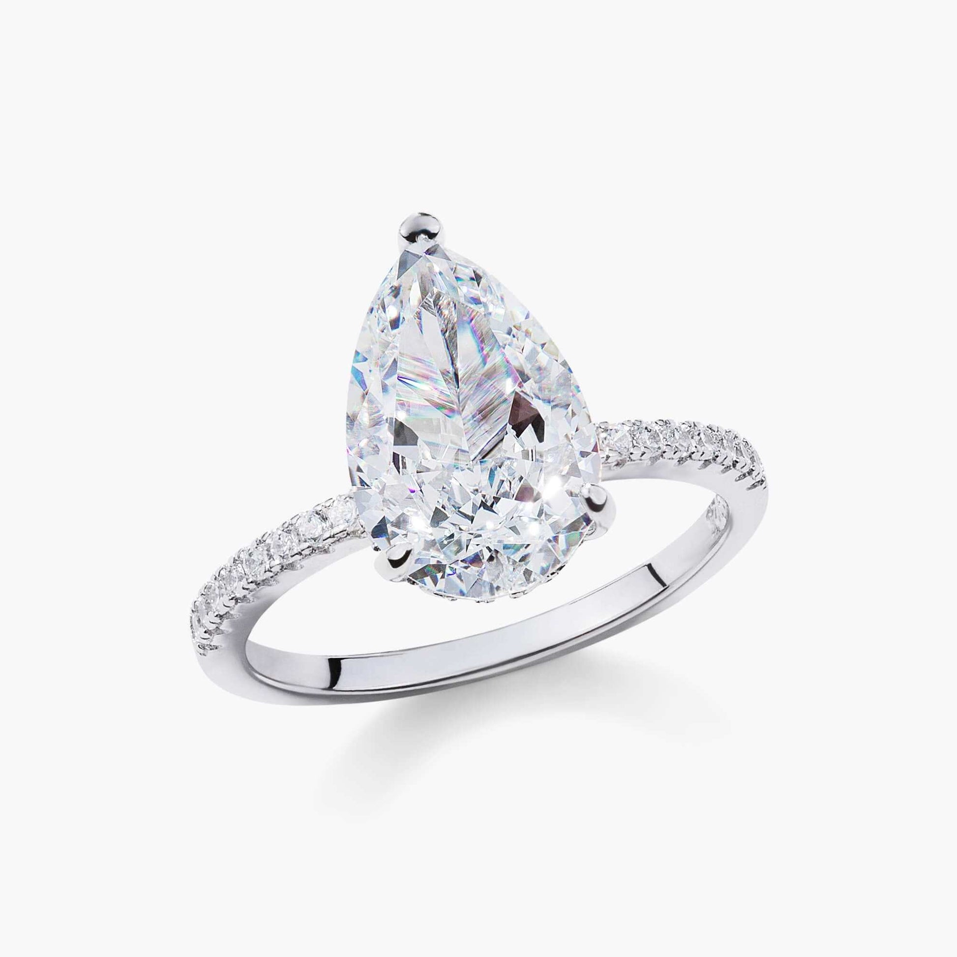 Kylariel pear-shaped moissanite engagement ring with half pavé band and hidden halo in white gold