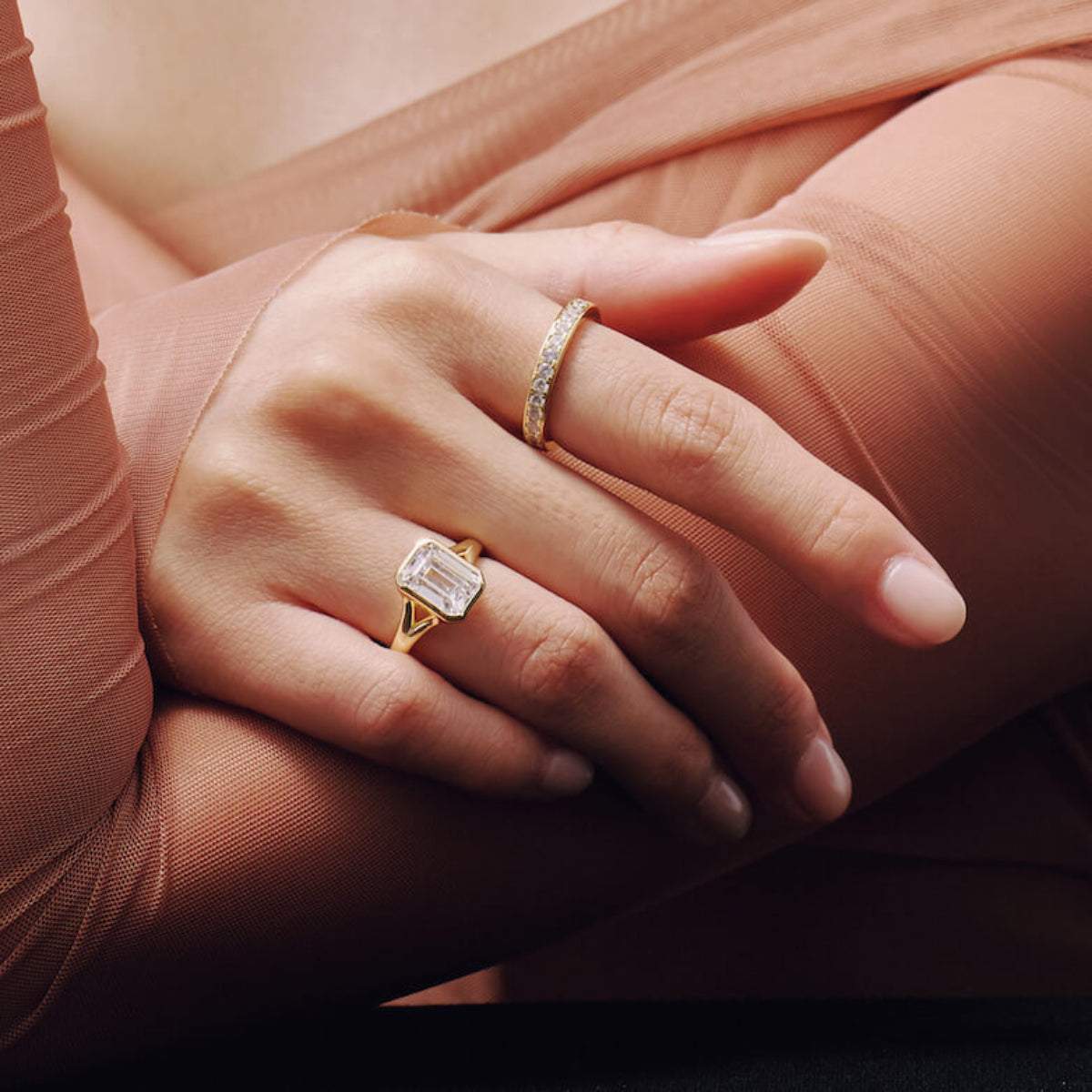 Selene eternity ring with petite round moissanite stones on elegant hand-worn finger