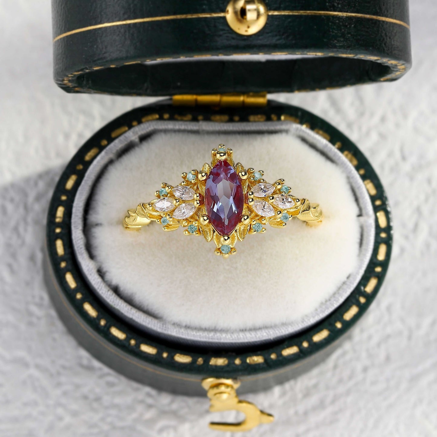 Lysaniel solitaire engagement ring with marquise lab Alexandrite and moissanite side stones in gold setting