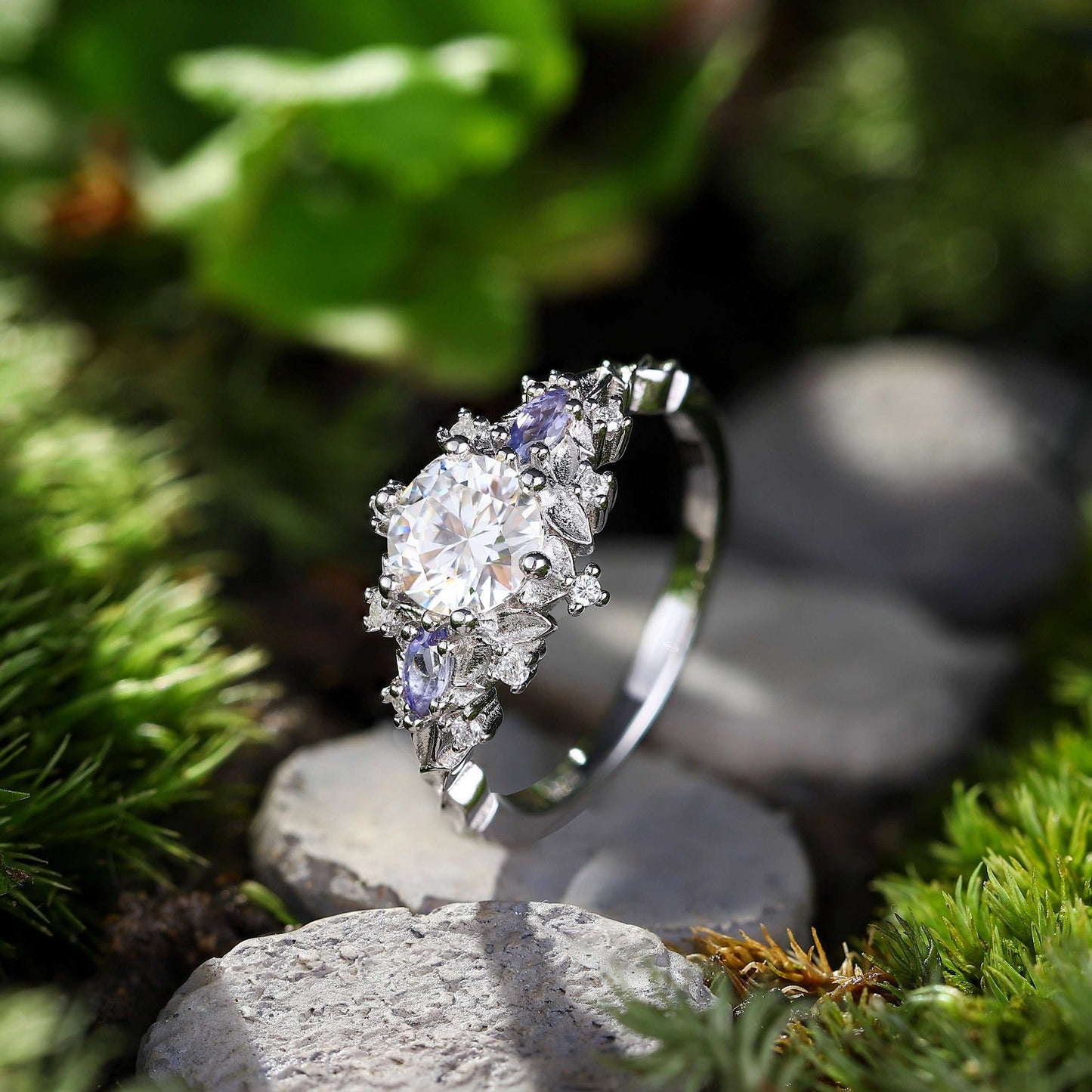 Rilaswen ring with round moissanite center stone and two smaller stones in elegant design
