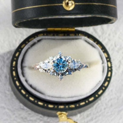 Nelawen three-stone engagement ring with 6mm aquamarine and marquise moissanite stones in black velvet box