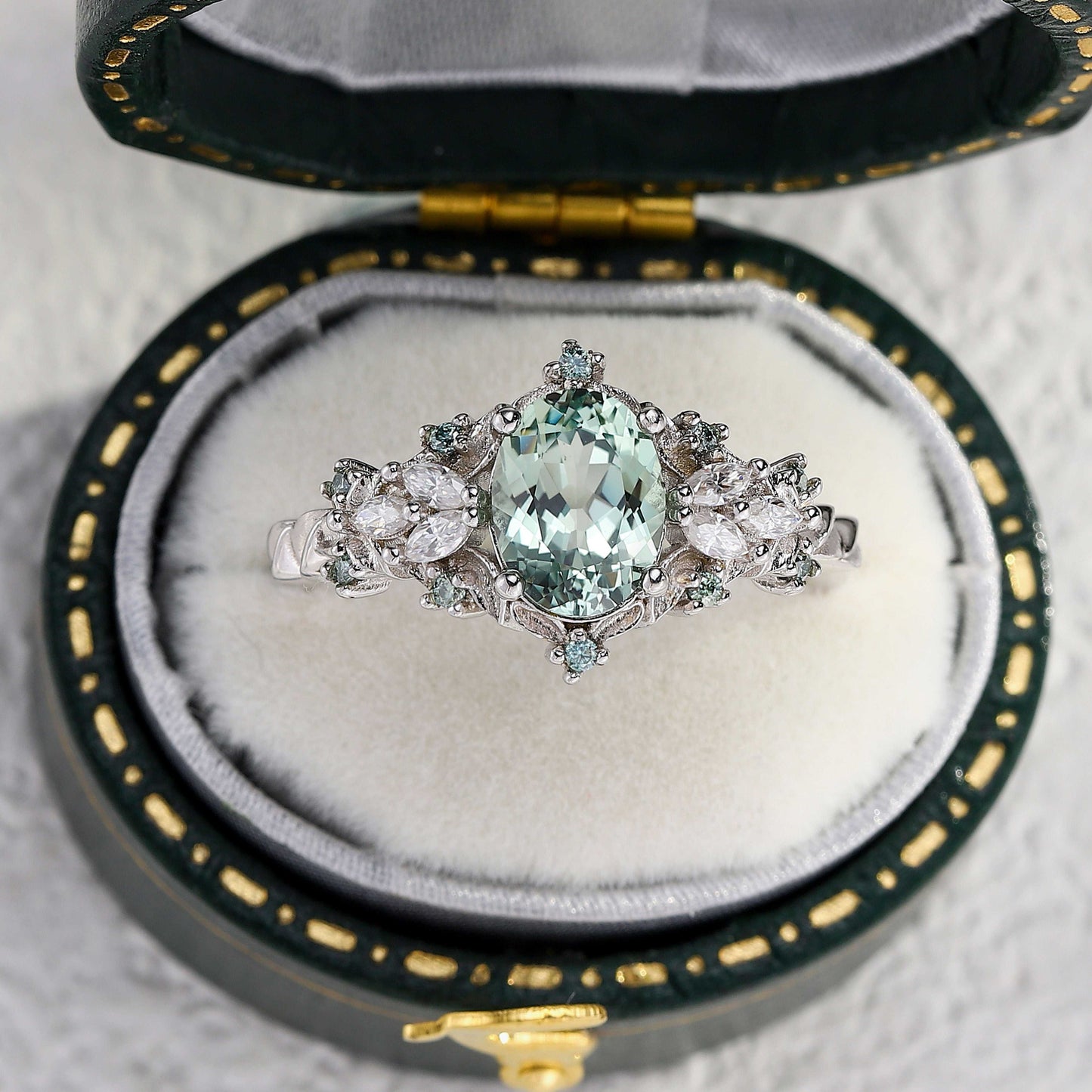 Tyranel engagement ring with oval sapphire and marquise moissanite halo in vintage box