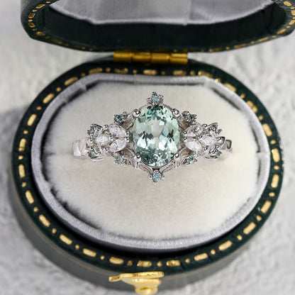Tyranel engagement ring with oval sapphire and marquise moissanite halo in vintage box