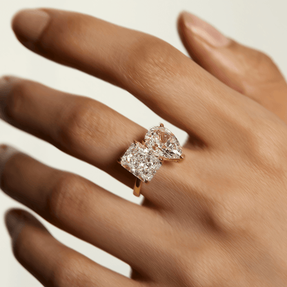 Lalinor Toi Et Moi engagement ring with 6.5-carat pear-shaped moissanite stones on hand