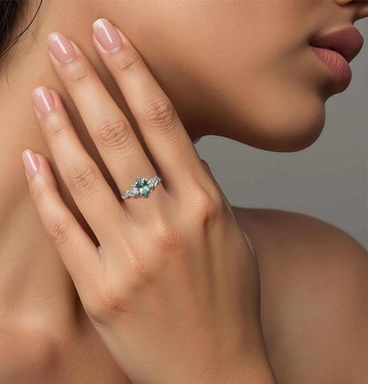 Dulawen three-stone engagement ring with oval sapphire and moissanite side stones on hand