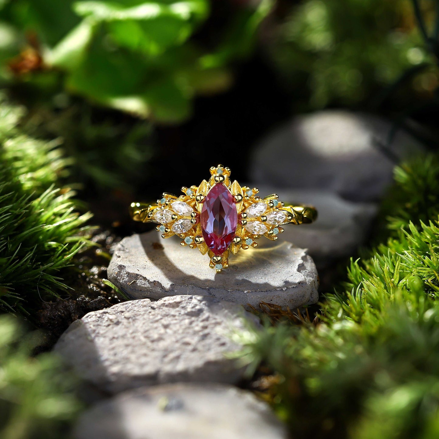 Lysaniel solitaire engagement ring with 8x4mm marquise alexandrite and 0.7ct marquise and round moissanite side stones on gold band