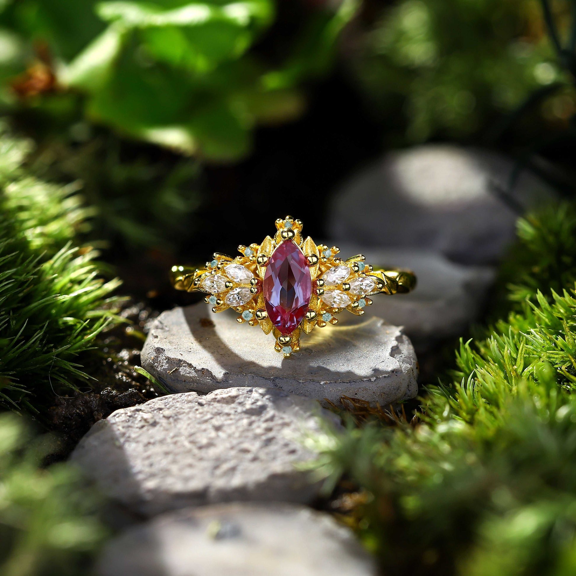 Lysaniel solitaire engagement ring with 8x4mm marquise alexandrite and 0.7ct marquise and round moissanite side stones on gold band