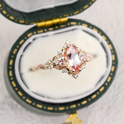 Nestariel solitaire engagement ring with marquise pink sapphire and diamond accents in vintage box