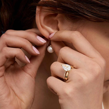 Kylariel pear-shaped moissanite solitaire engagement ring with half pavé and hidden halo on gold band