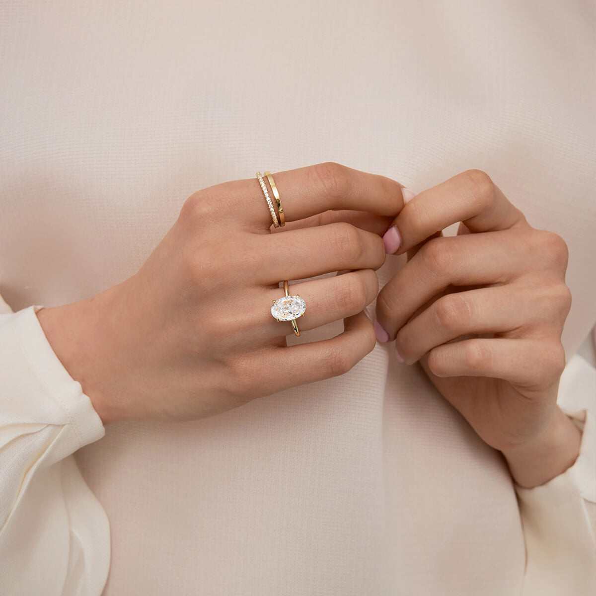 Deus Ring Pherinwen with oval-cut 3-carat moissanite solitaire on hand