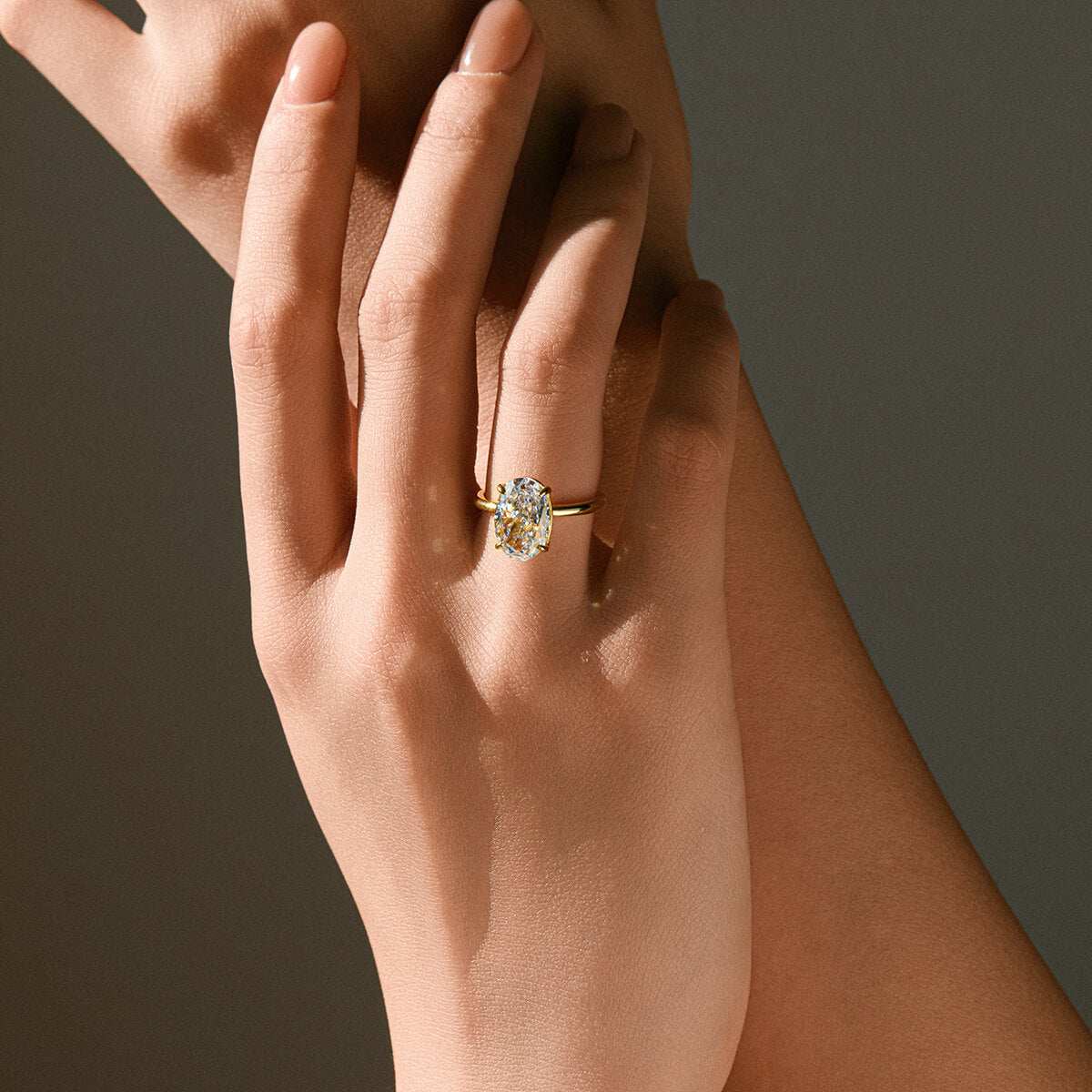 Deus Ring Pherinwen with oval-cut 3-carat moissanite solitaire on hand