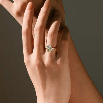 Deus Ring Pherinwen with oval-cut 3-carat moissanite solitaire on hand