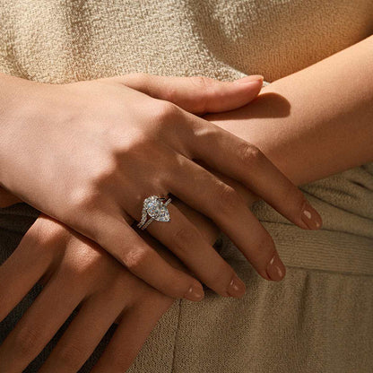 Kylariel pear-shaped moissanite solitaire engagement ring with half pavé and hidden halo on hand