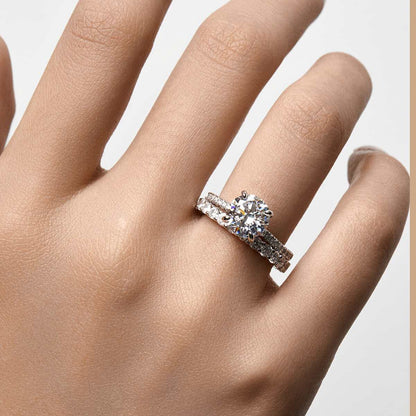 Ysinwen ring with round moissanite stone and pave band on hand