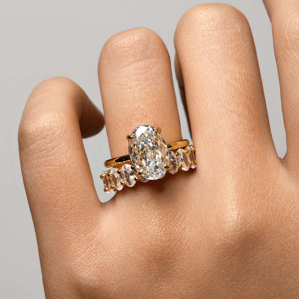 Deus Ring Pherinwen oval-cut moissanite solitaire ring with crushed ice effect on hand