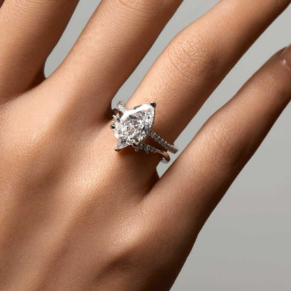 Kylariel solitaire engagement ring with pear-shaped moissanite and half pavé band on hand