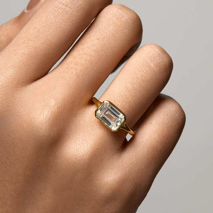 Roen Ring Damariel with east-west emerald-shaped moissanite and split shank design on hand