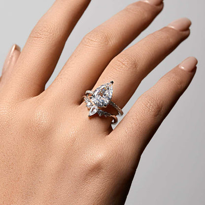 Kylariel pear-shaped moissanite solitaire engagement ring with half pavé and hidden halo on hand