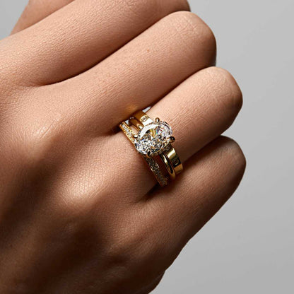 Nolindra oval moissanite solitaire engagement ring with pavé hidden halo on hand