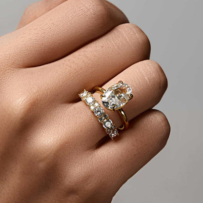 Nolindra oval Moissanite solitaire engagement ring with pavé hidden halo on hand