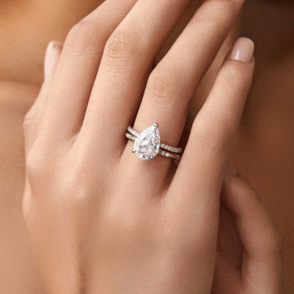 Kylariel pear-shaped moissanite solitaire engagement ring with half pavé and hidden halo on hand