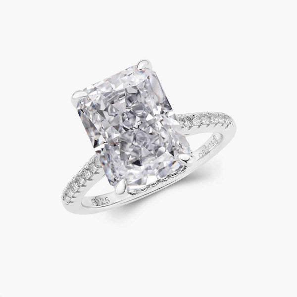 Lethriel solitaire ring with 6-carat radiant-cut moissanite, half pavé band, and hidden halo design