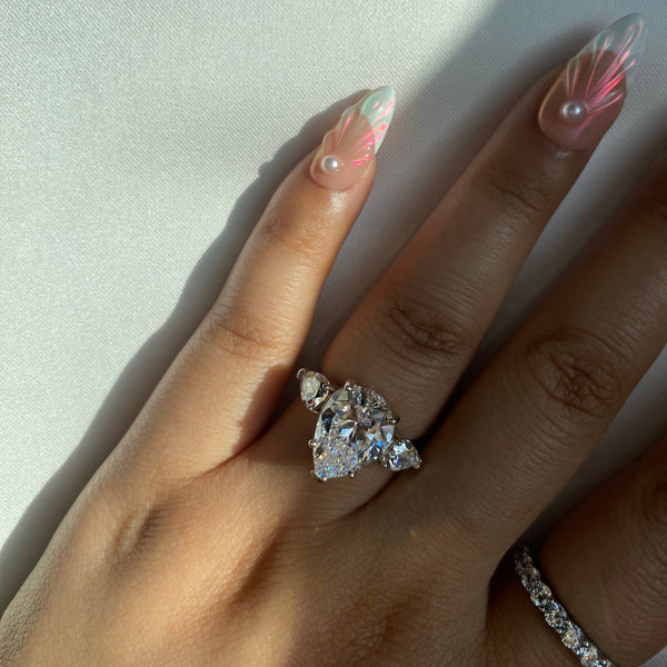 Vinarwen 4 Carat Pear Three-stone Moissanite Ring