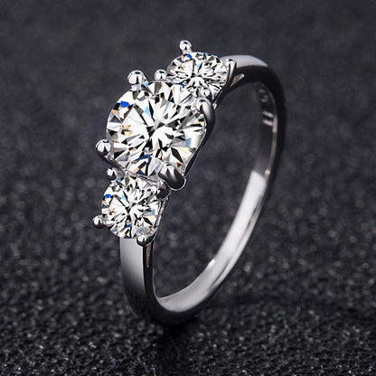 Cariniel 4 Carat Round Brilliant Three-stone Moissanite Ring