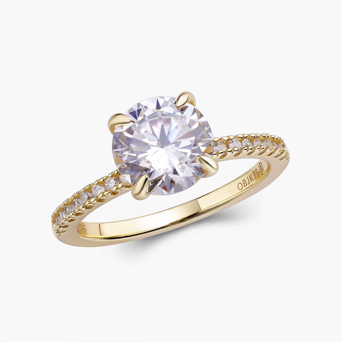 Ysinwen solitaire ring with round moissanite and pave gold band
