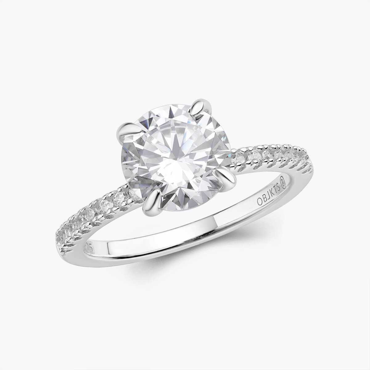 Ysinwen ring with a brilliant round moissanite stone and pave band solitaire design